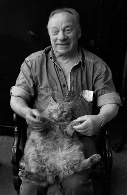 senior-man-stroking-cat-at-home