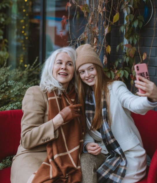 woman-in-white-jacket-beside-woman-in-brown-coat