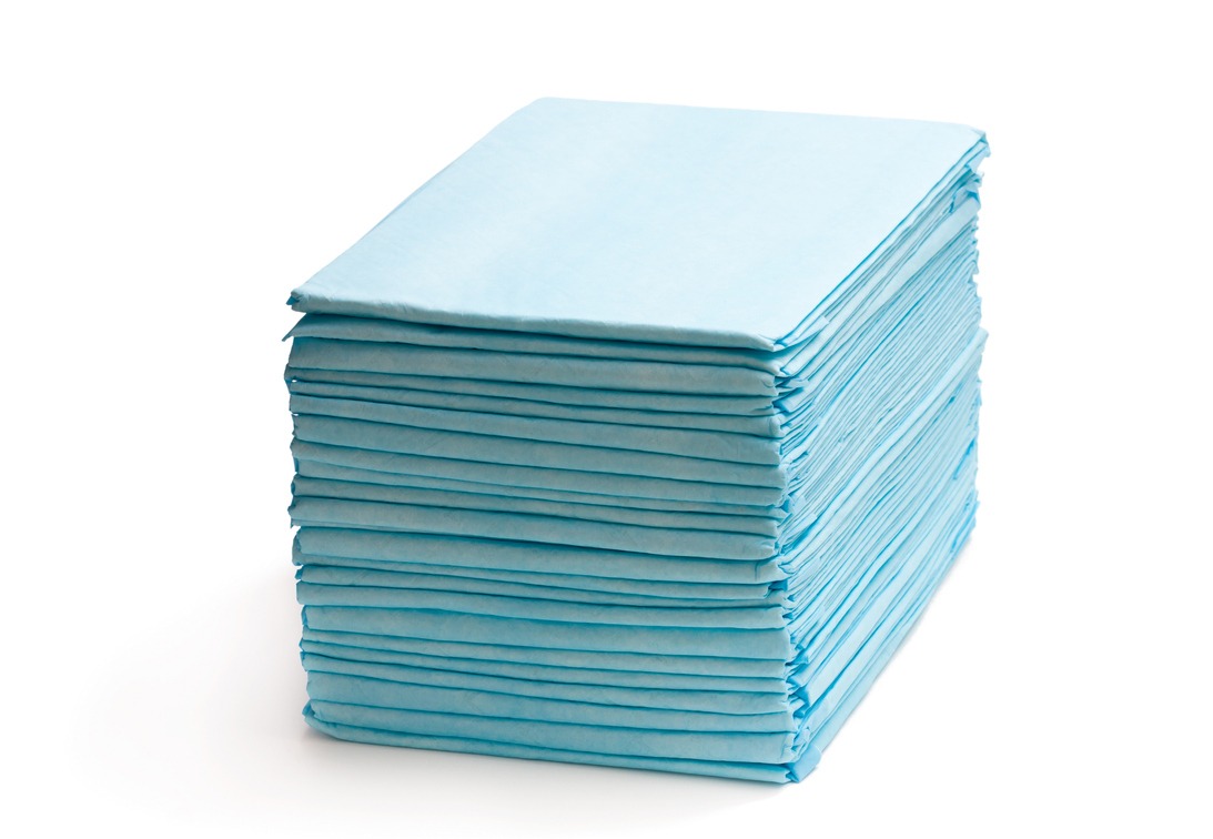 a stack of bed pads