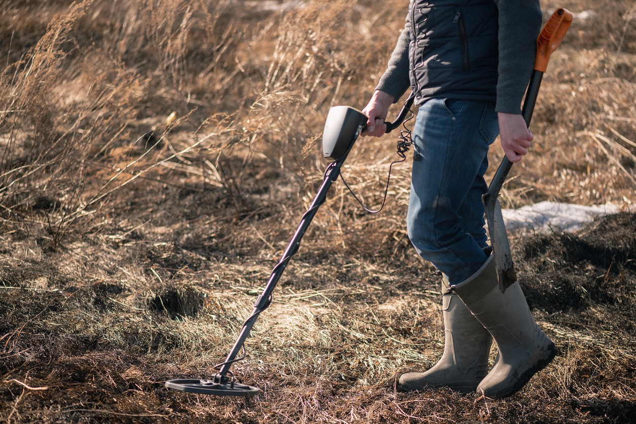 man using a metal detector