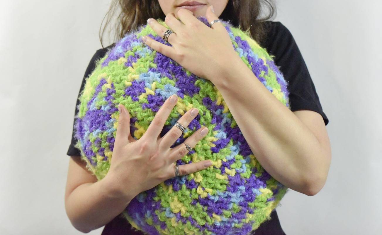 woman hugging a sensory cushion