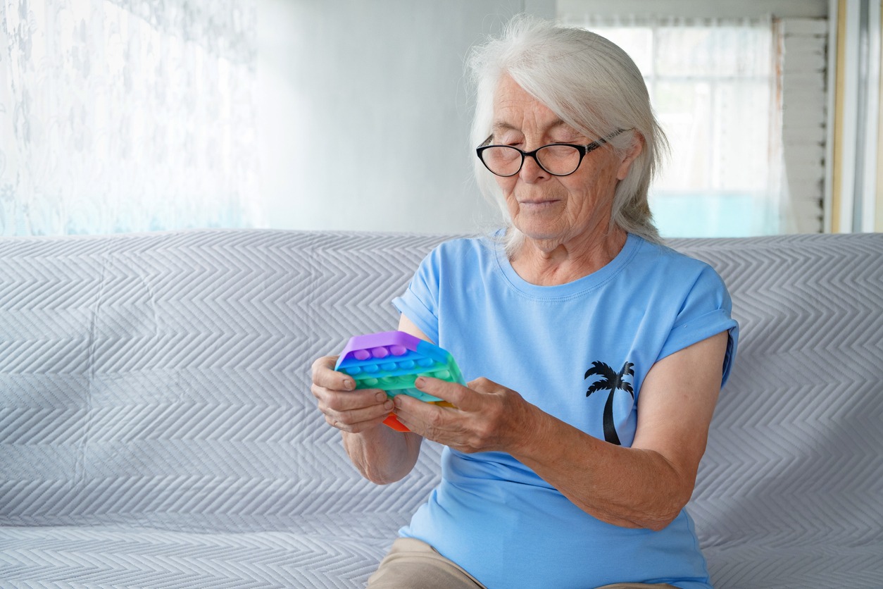 woman playing with a fidget toy