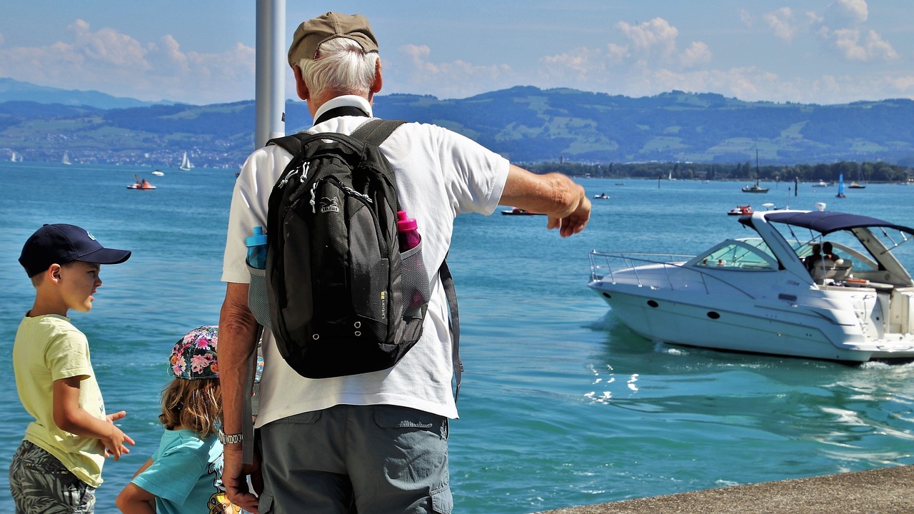 grandfather with his grandkids at the beach 