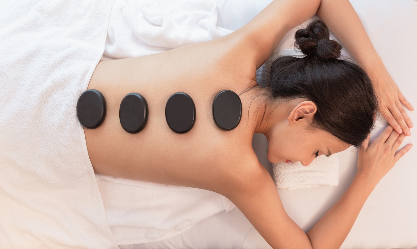 woman getting a hot stone massage