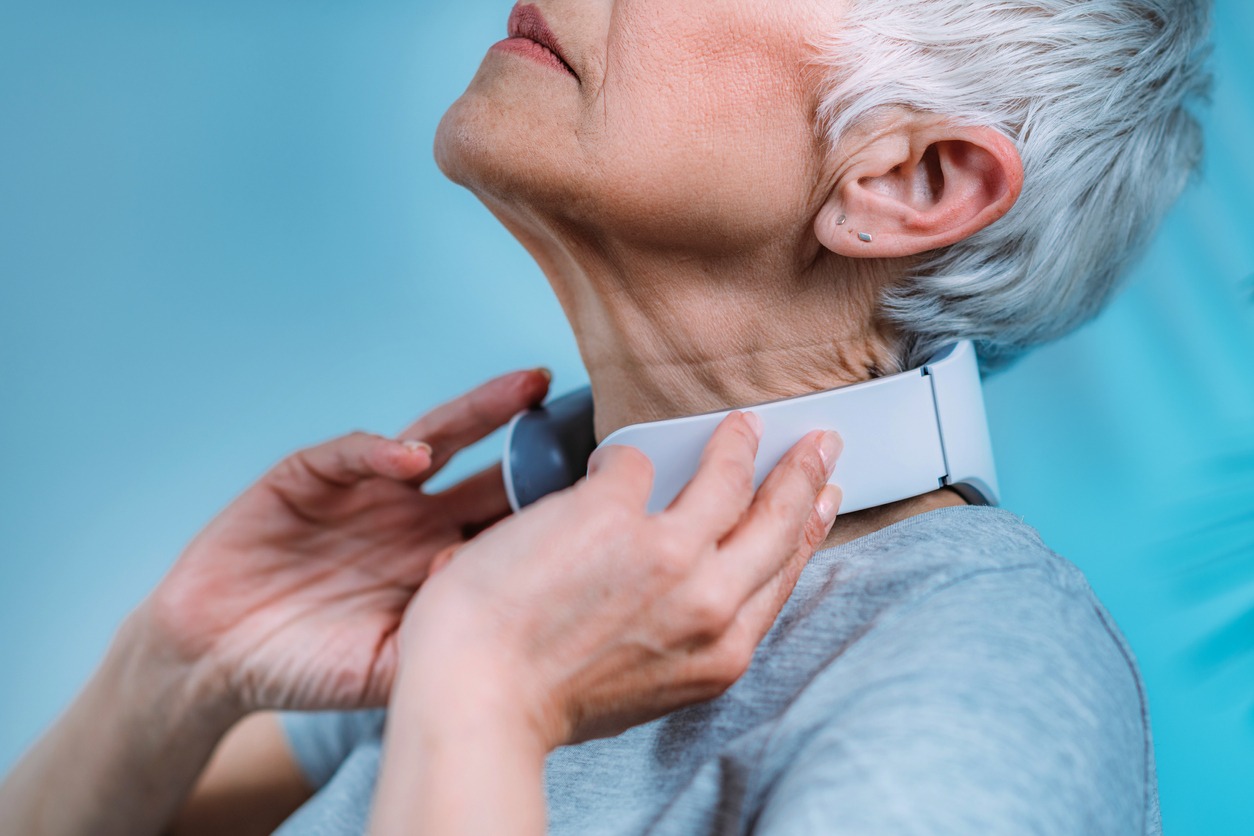 woman using a neck massager