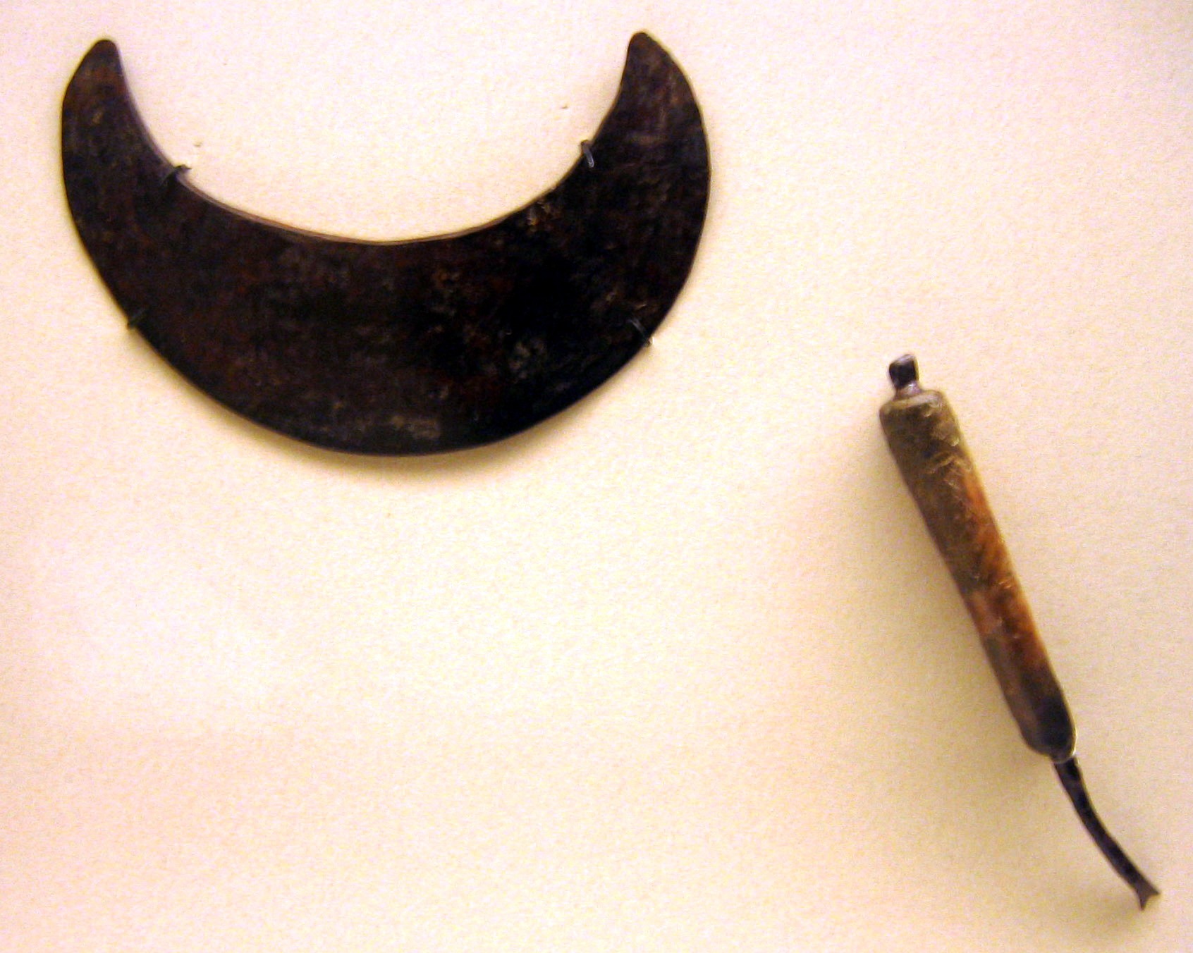 Razor (top) and nail cutter with bone handle (bottom) found in a grave of the Hallstatt culture (c. 6th–8th centuries BC)
