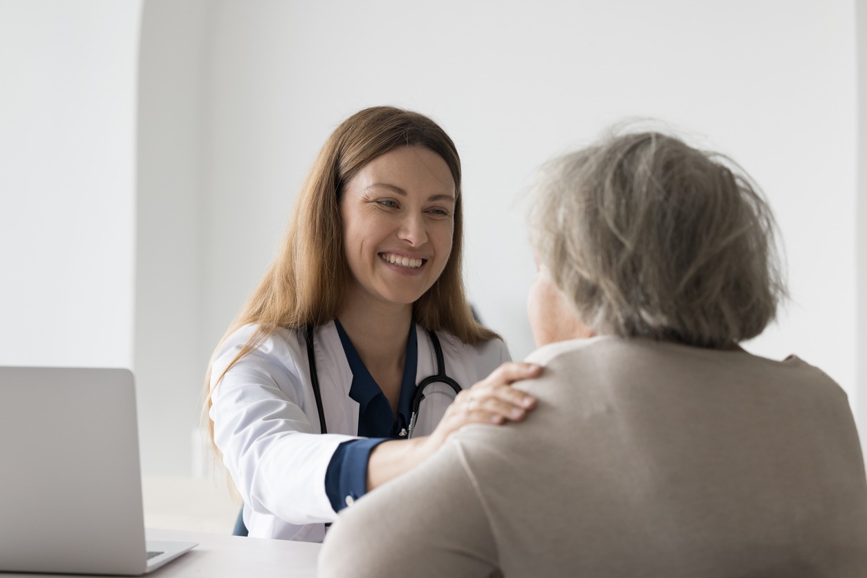 Positive happy practitioner seeing older patient