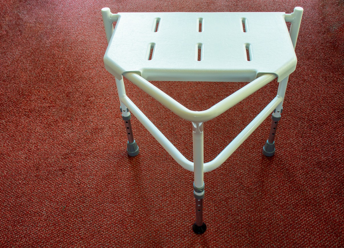 a plastic shower stool