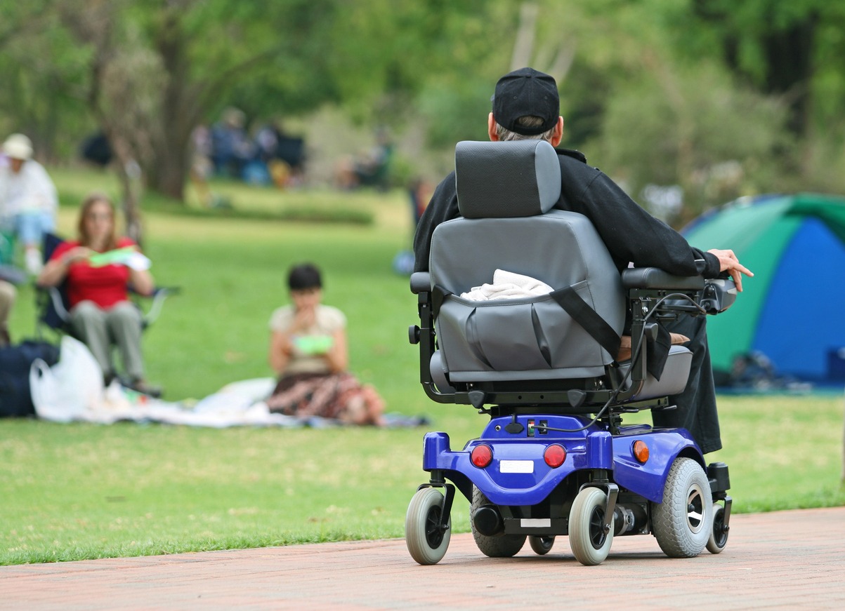 elderly man on an electric wheelchair