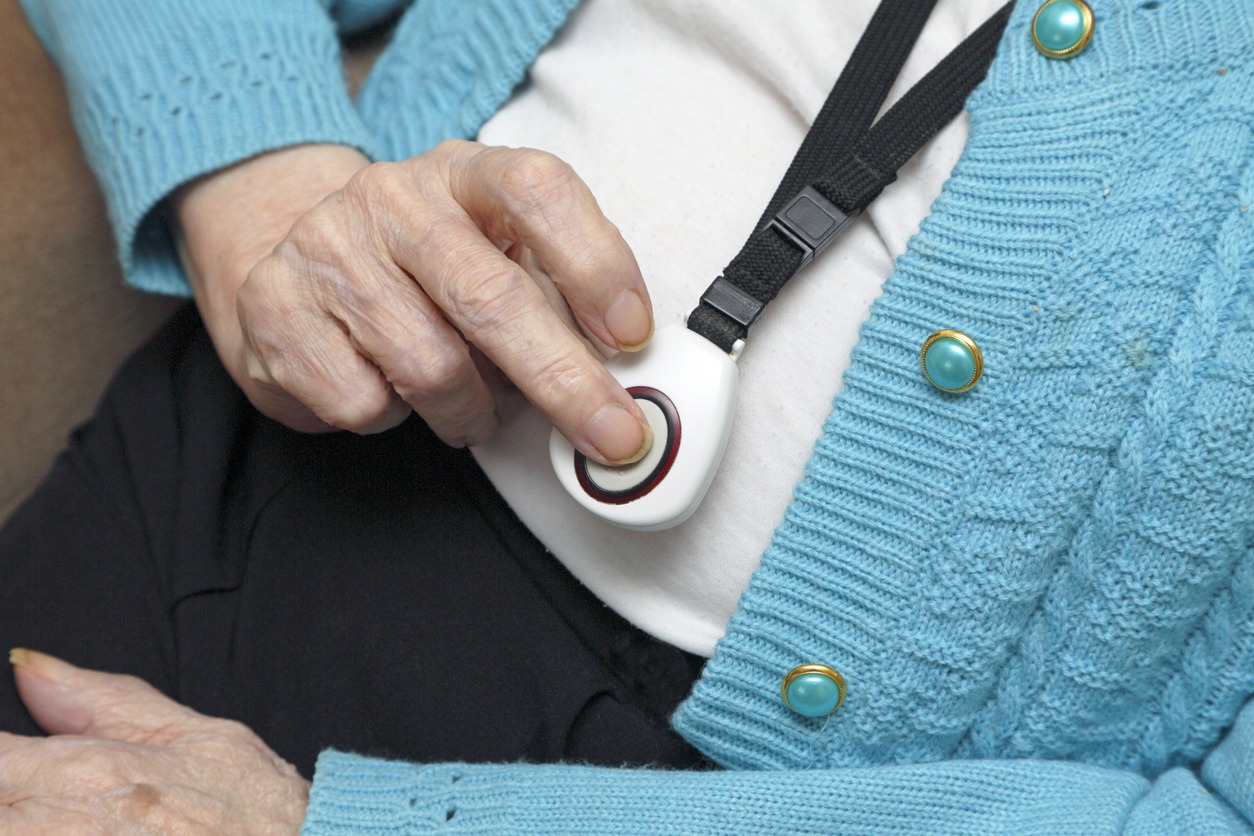 elderly woman using a panic button