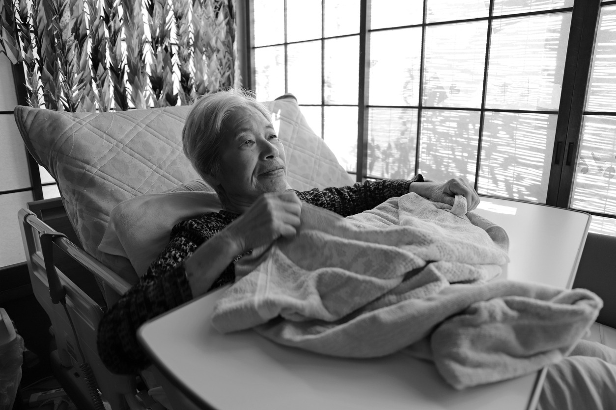 elderly woman with an over the bed table