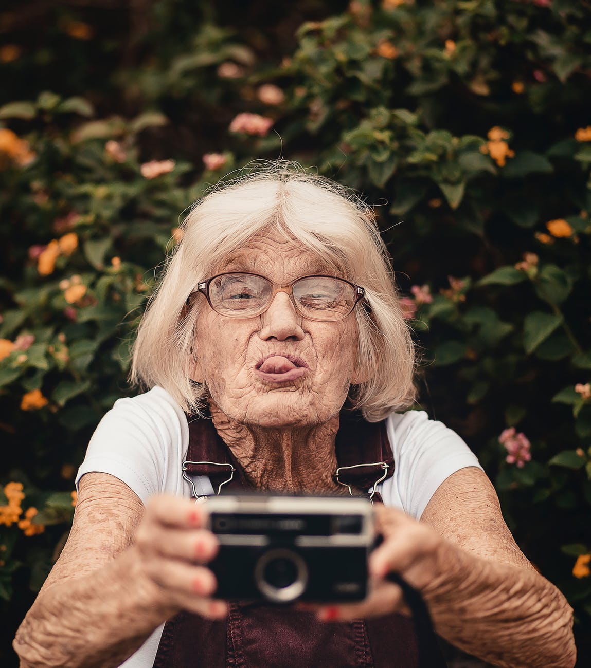happy old woman taking a selfie
