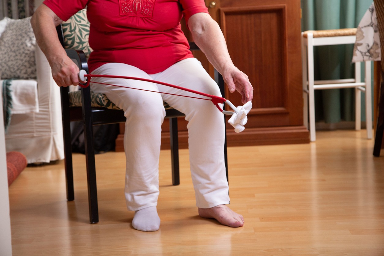 senior woman using a reacher