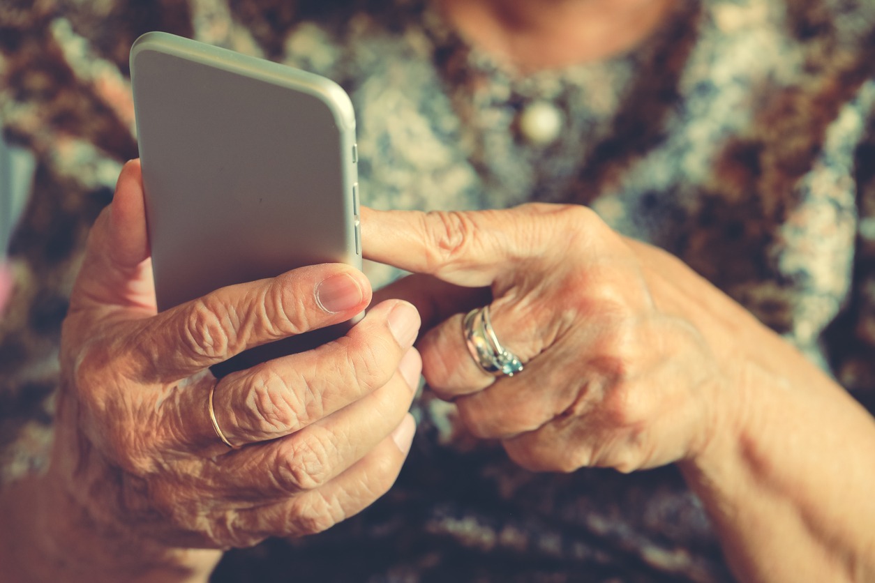 smartphone used by an elderly woman