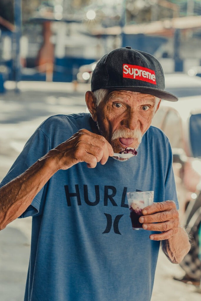 an older adult eating ice cream