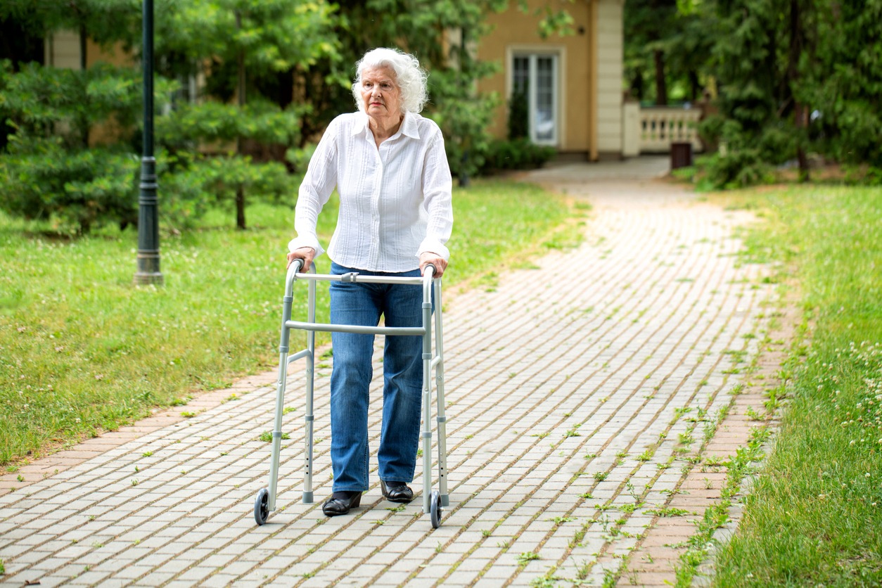 senior woman with a two-wheel walker