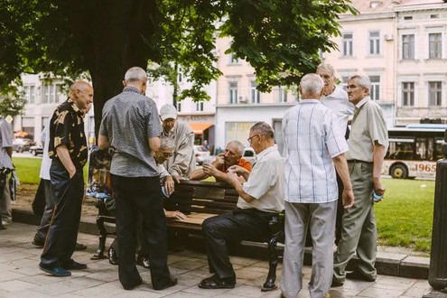 A group of senior citizens having chit chat during daytime