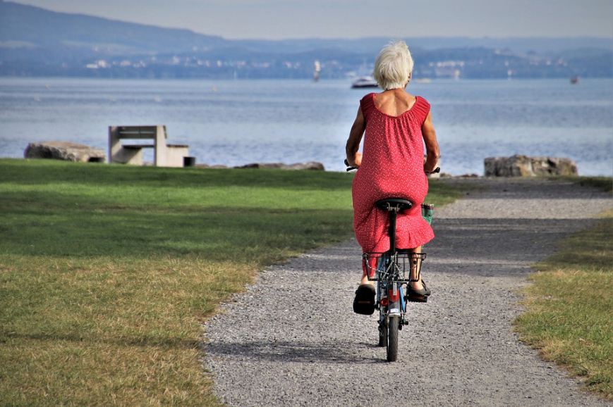 An elderly enjoying a bicycle ride