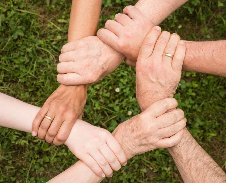 Image of hands showing unity.