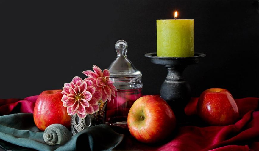 Picture with apples and candle decor.