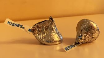 The traditional packaging of Hershey's kisses in silver foil