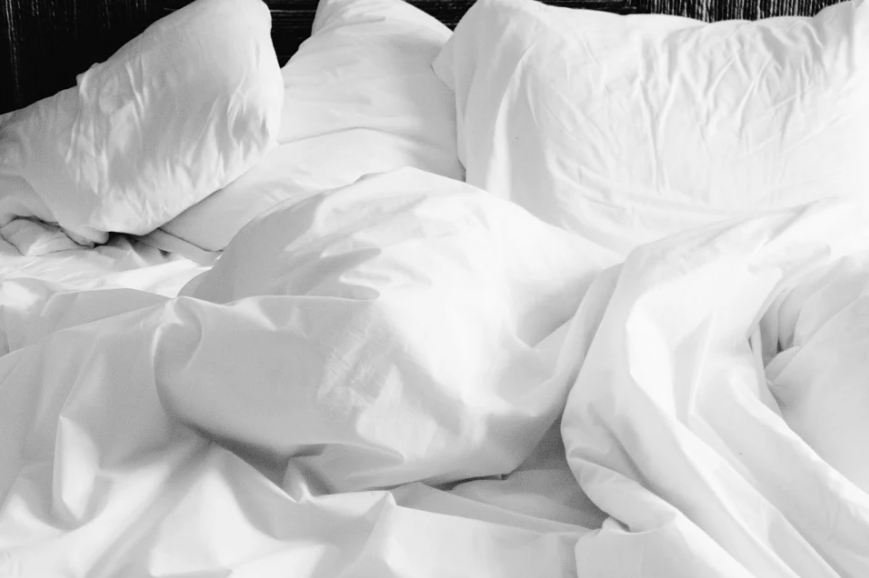 White Blanket and Linen Sheets