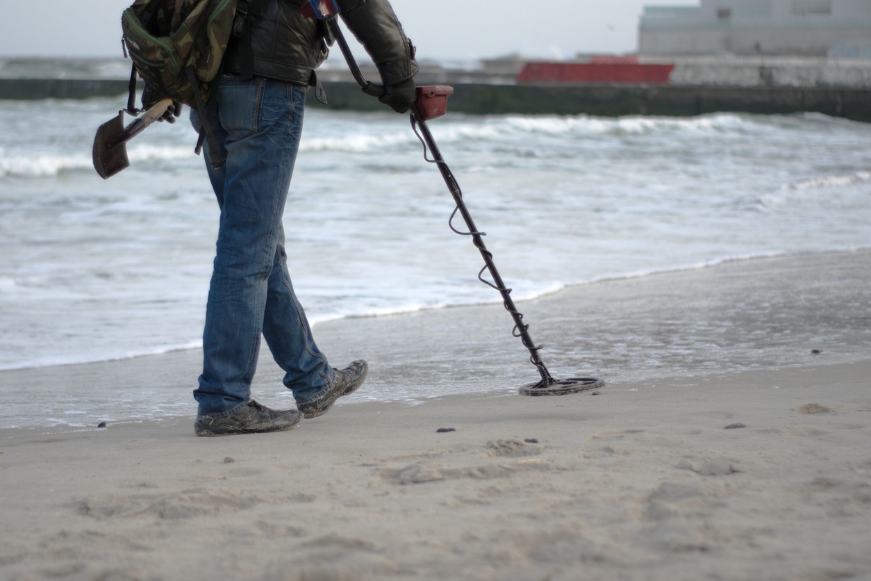metal detecting by the beach