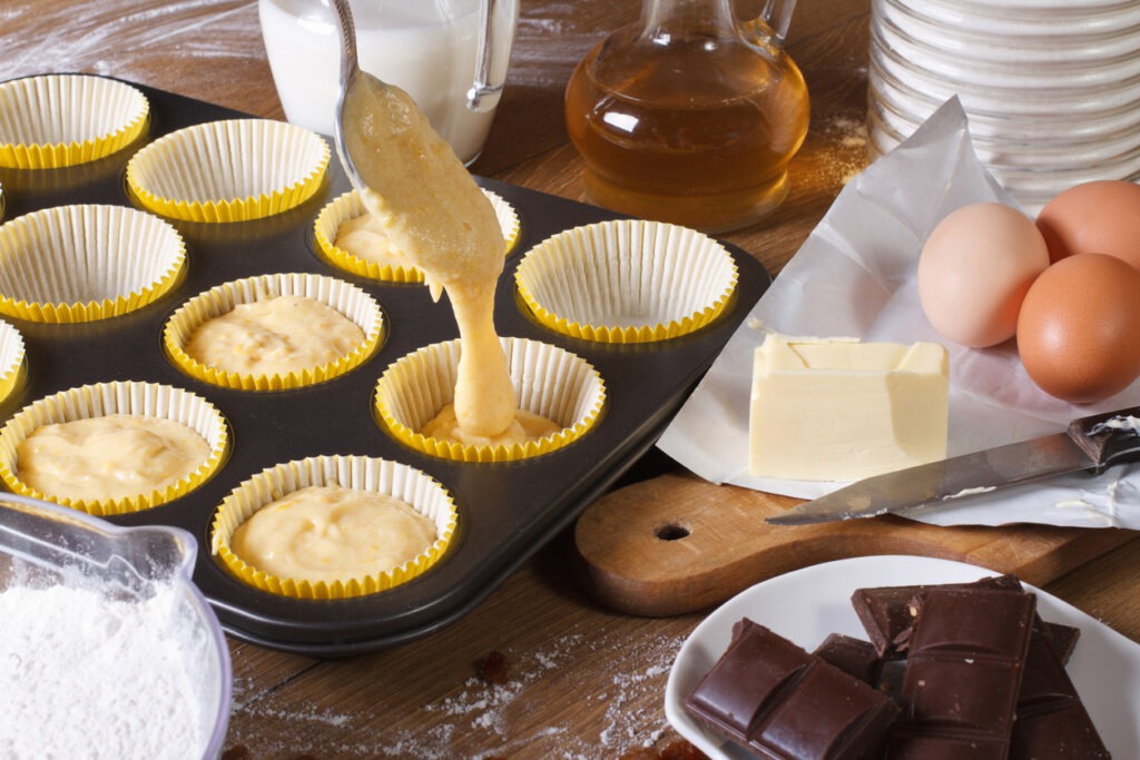 The process of preparing cupcakes in the kitchen, ingredients closeup horizontal