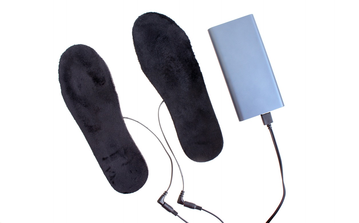 a pair of heated insoles