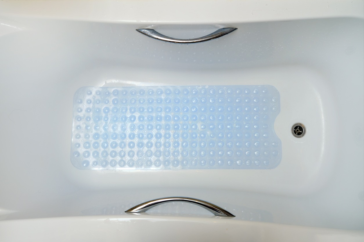 an anti-slip bath mat in the bathtub