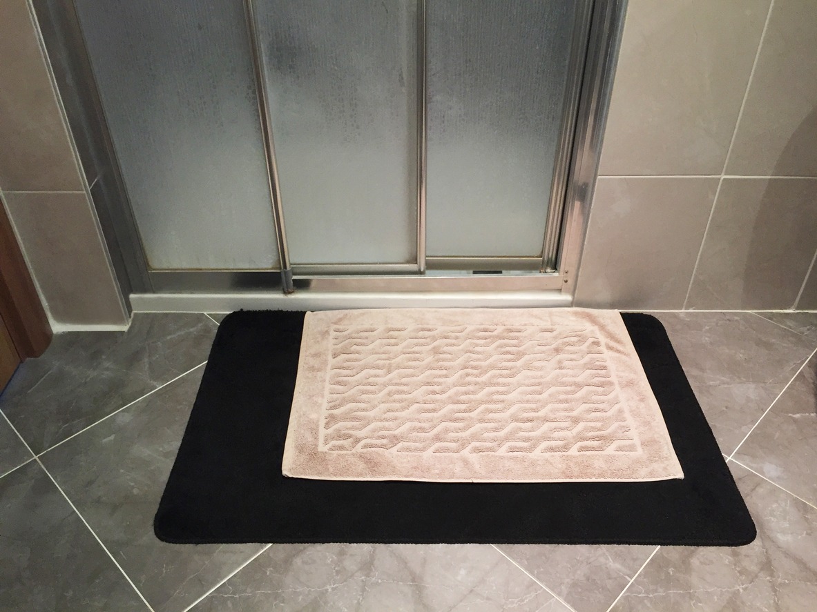an anti-slip bath mat outside the shower