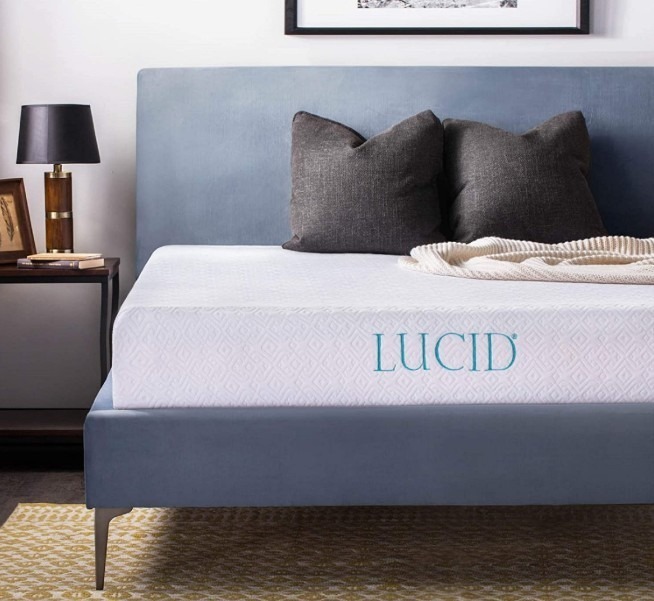 A-lucid-mattress-placed-on-a-double-bed-with-a-couple-of-pillows-and-a-side-table