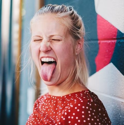 A woman sticking out her tongue
