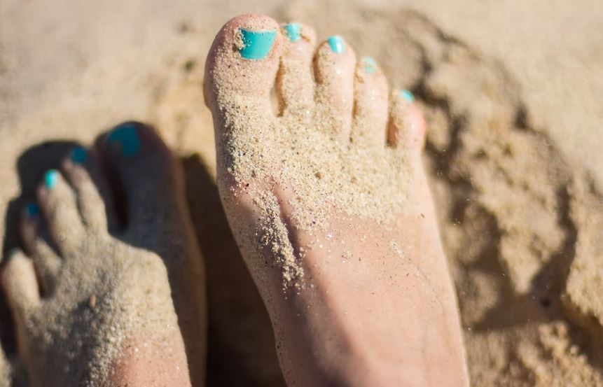 Sandy feet at beach