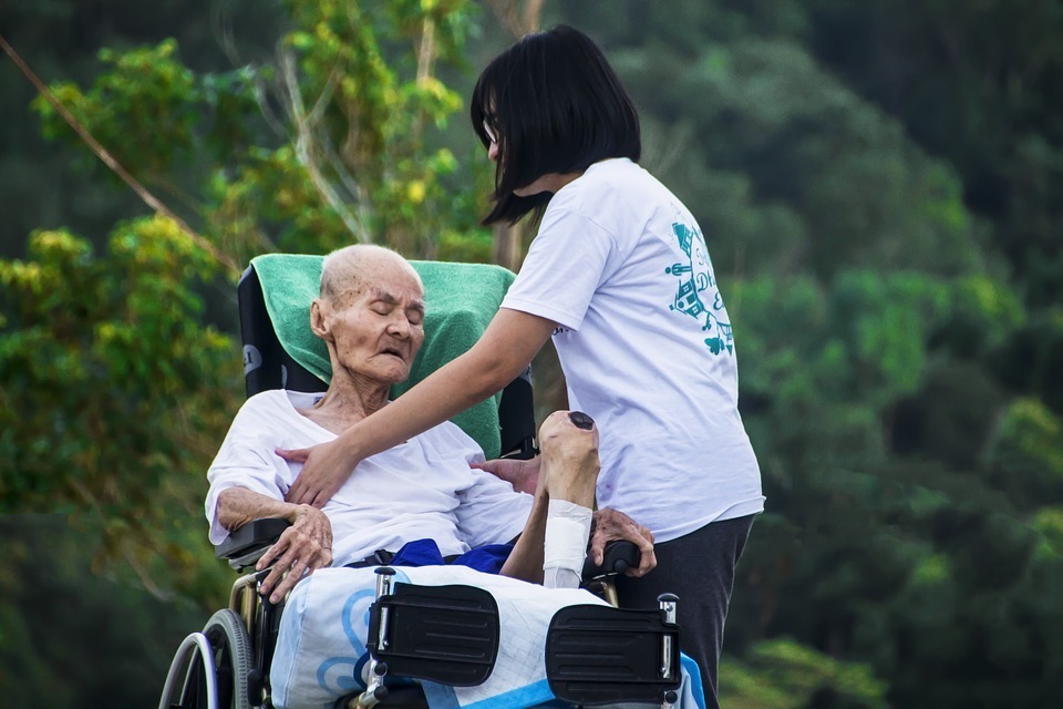 a-caregiver-taking-care-of-an-older-person