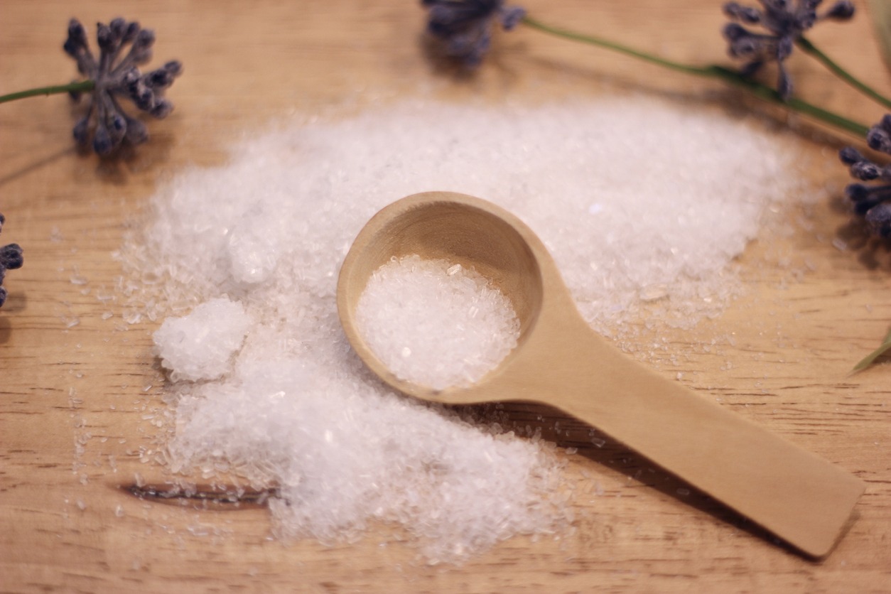 Epsom salt with a wooden spoon
