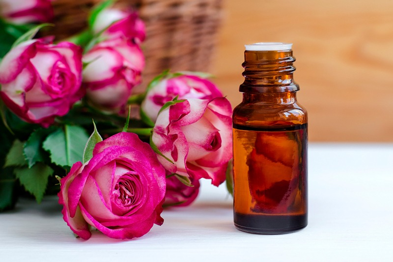 a bottle of rose essential oil
