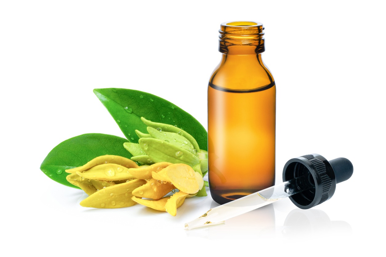 a bottle of ylang-ylang essential oil 