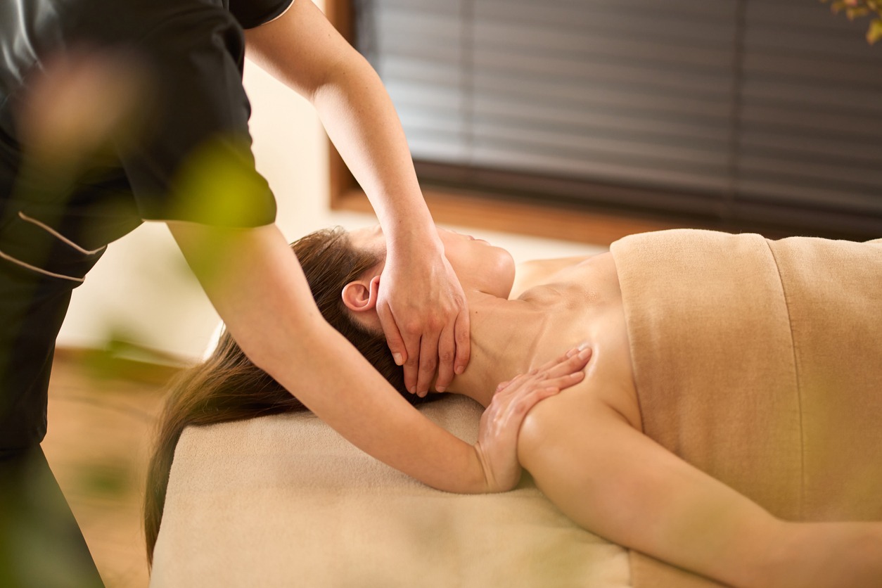 a woman getting a neck massage
