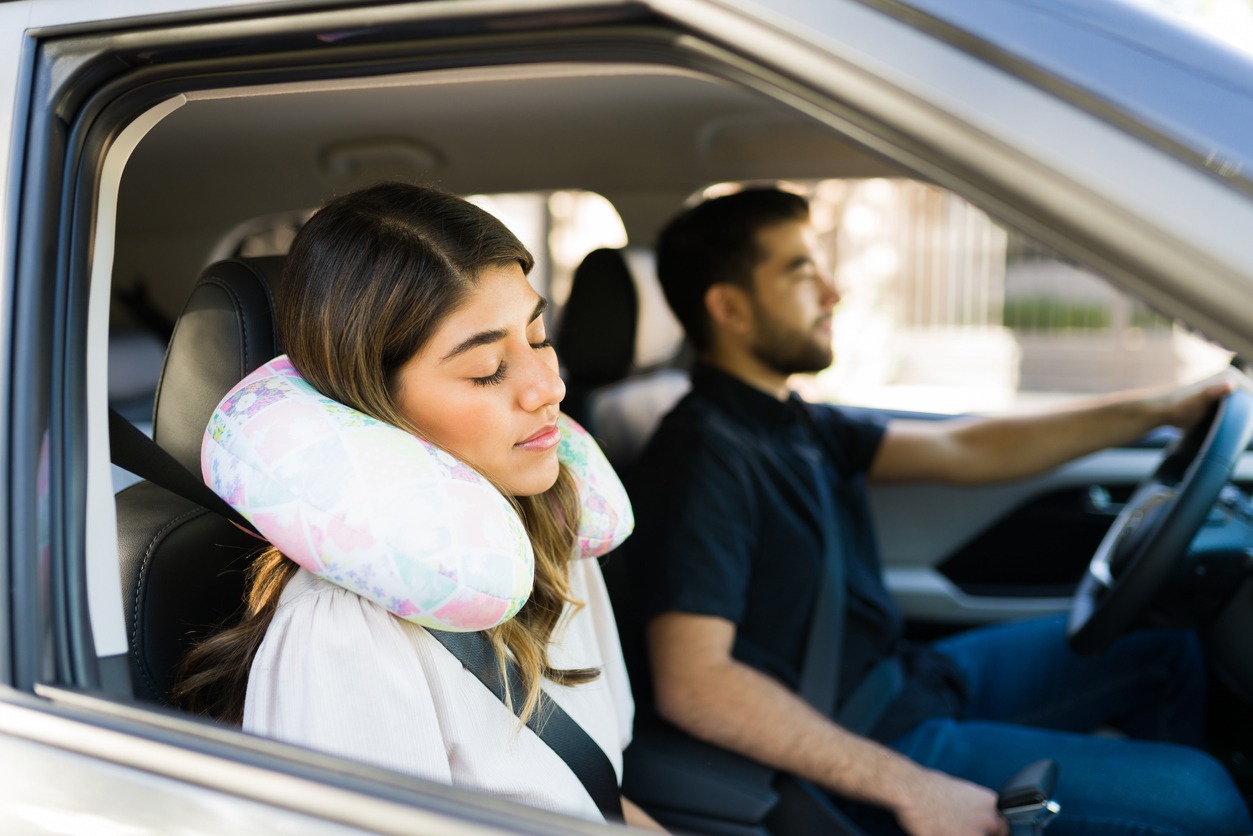 using a neck pillow in a car