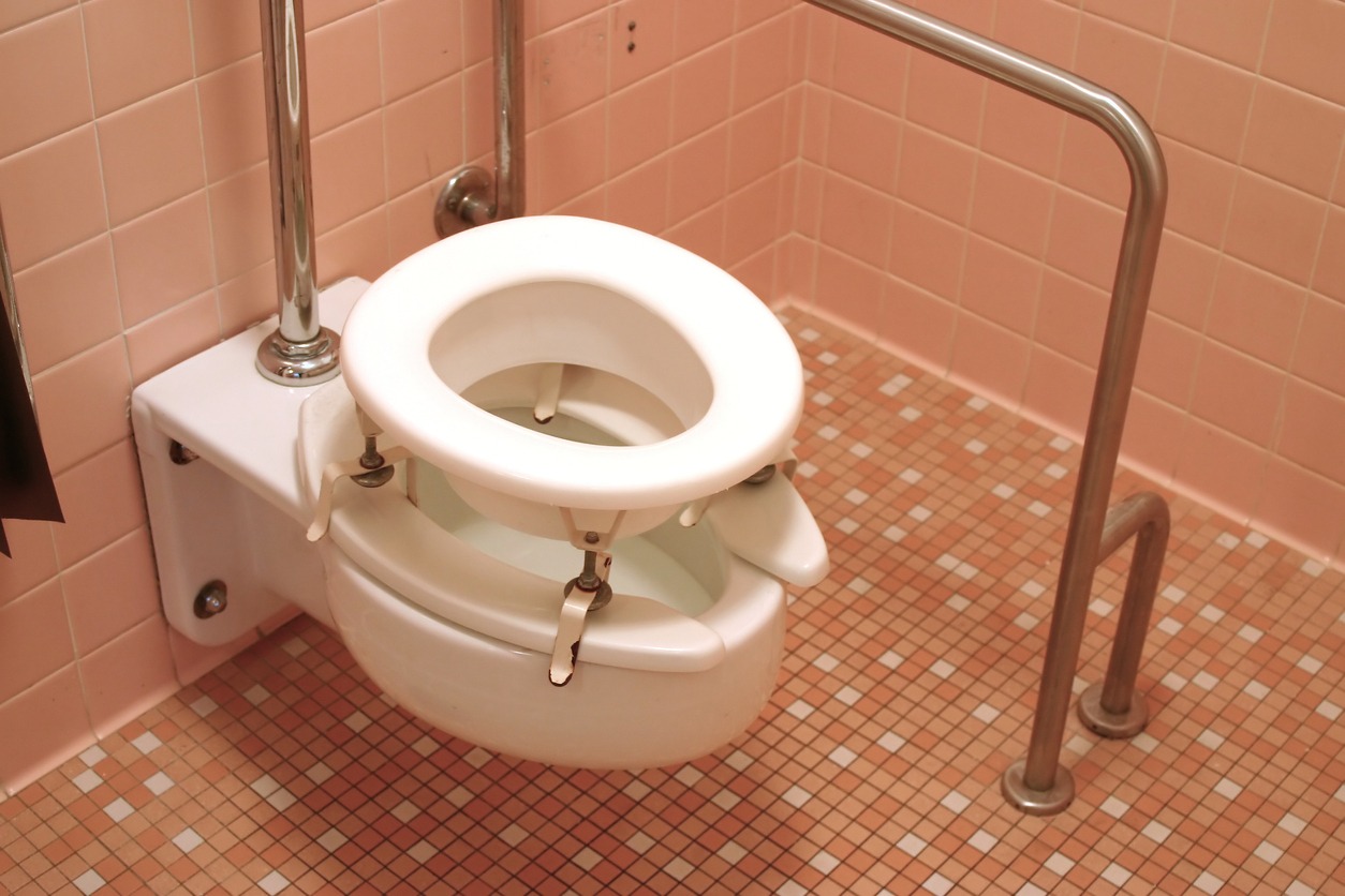 a raised toilet seat with metal frame