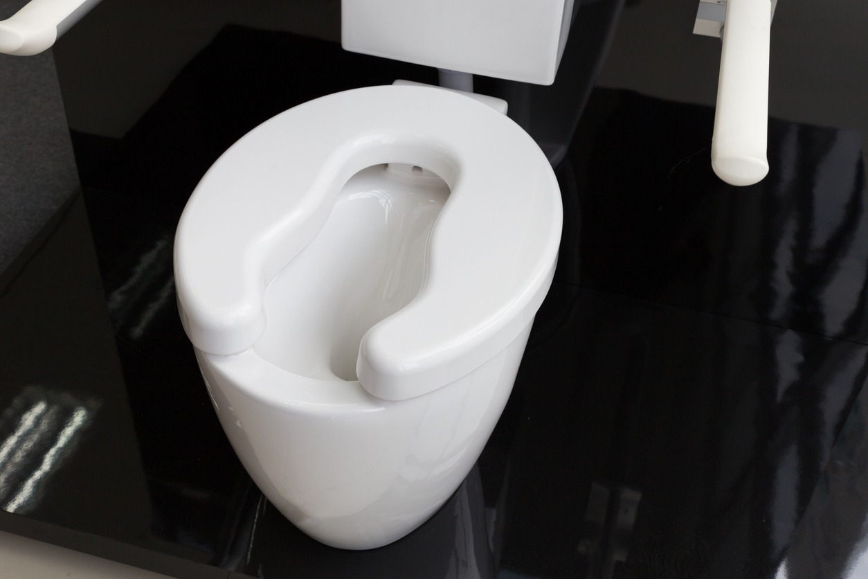 a toilet for elderly people with raised seat