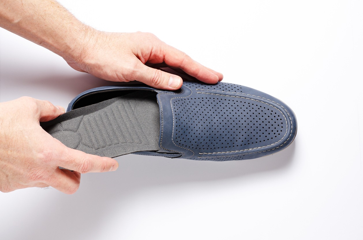 inserting an insole in a shoe