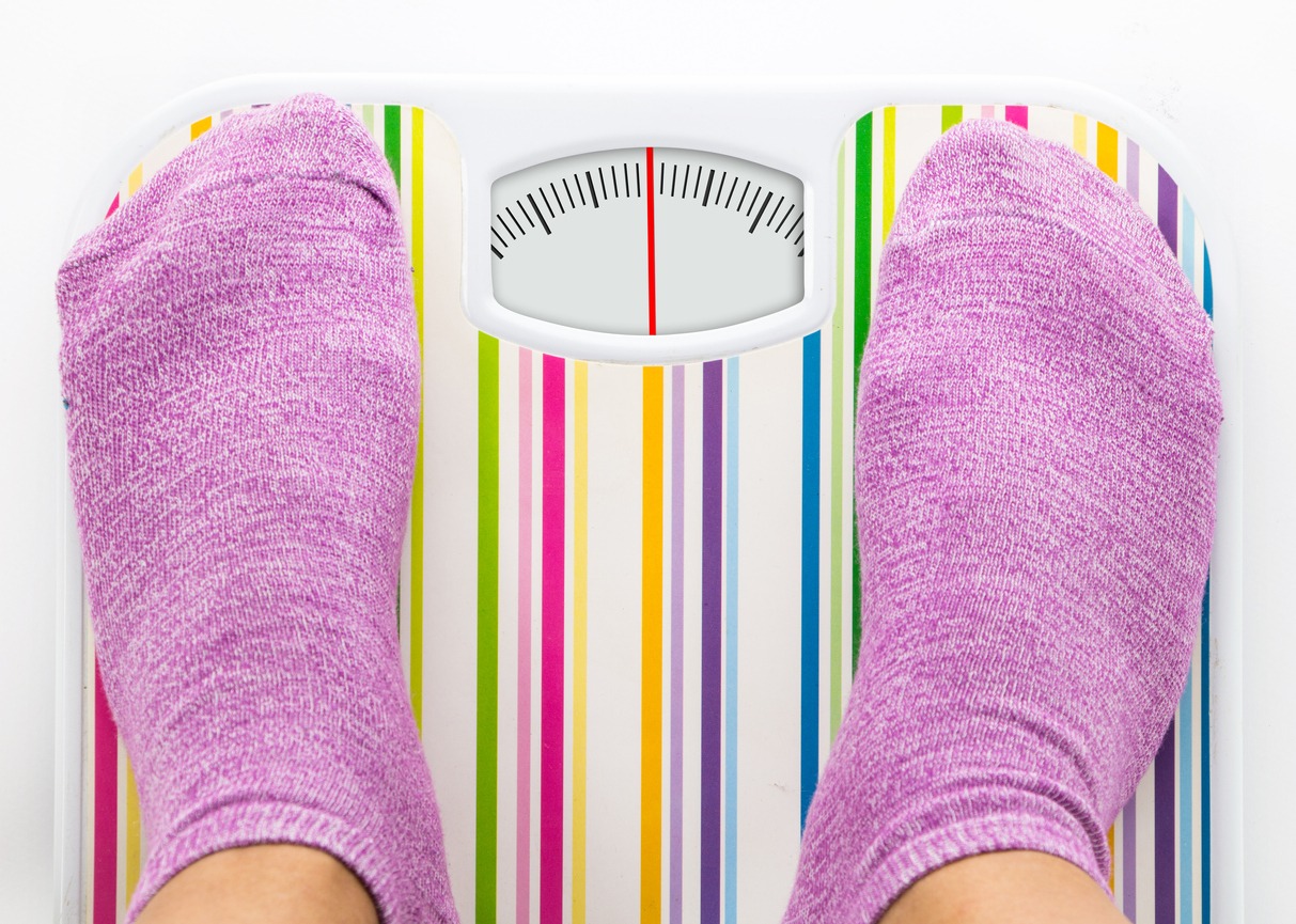 purple socks and weighing scale