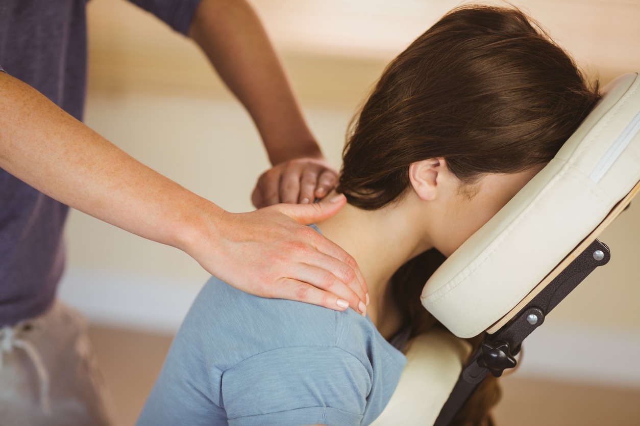 woman getting treatment for neck pain