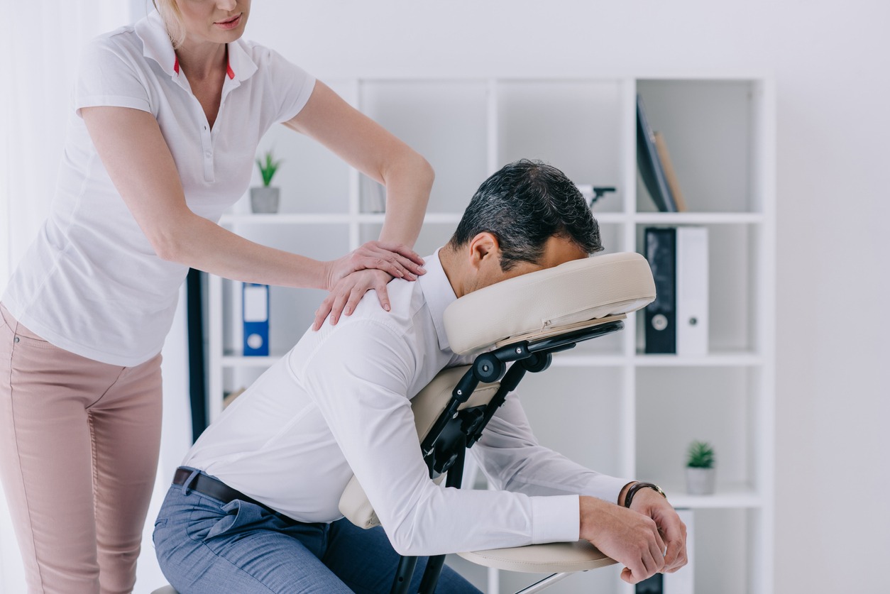 man receiving a chair massage