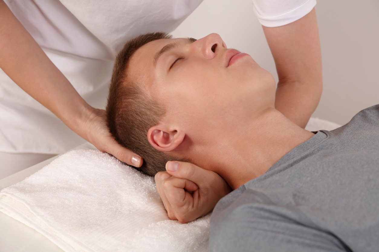 man receiving craniosacral massage