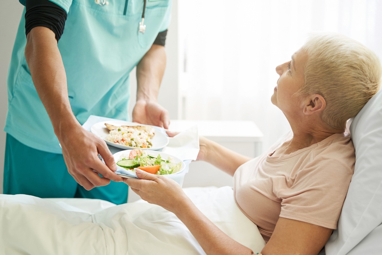 giving food to a patient