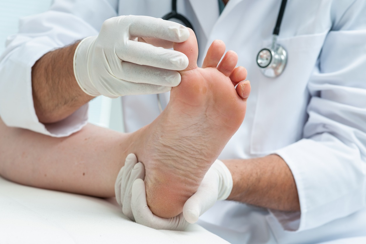 doctor checking a patient’s foot