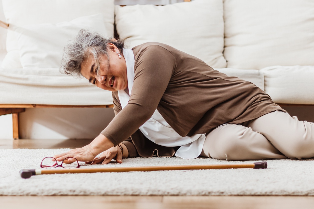 elderly woman falling on a floor mat